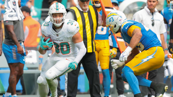  Miami Dolphins fullback Alec Ingold (30) carries the football against Los Angeles Chargers linebacker Troy Dye (43) during the fourth quarter at Hard Rock Stadium. 