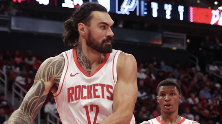 Oct 17, 2024; Houston, Texas, USA; Houston Rockets center Steven Adams (12) passes against the San Antonio Spurs in the second quarter at Toyota Center. Mandatory Credit: Thomas Shea-Imagn Images