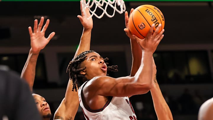 Dec 22, 2024; Columbia, South Carolina, USA; South Carolina Gamecocks forward Collin Murray-Boyles (30) drives past Radford Highlanders forward Isaiah Gaines (6) in the first half at Colonial Life Arena. Mandatory Credit: Jeff Blake-Imagn Images