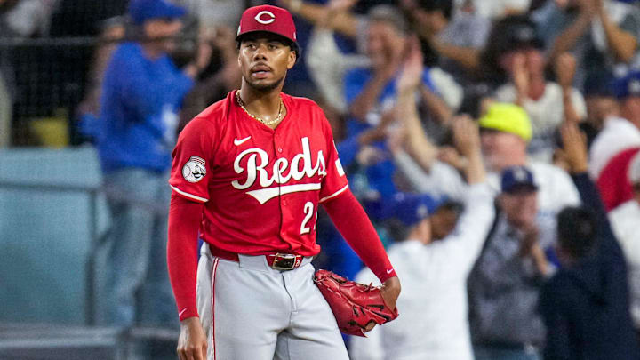 Cincinnati Reds starting pitcher Hunter Greene (21) reacts as Los Angeles Dodgers right fielder Teoscar Hernandez (37) runs the bases on a three-run home run in the third inning of the MLB National League Wild Card Game 1 between the Los Angeles Dodgers and the Cincinnati Reds at Dodger Stadium in Los Angeles on Tuesday, Sept. 30, 2025. The Dodgers won game 1 of the series, 10-5. Cincinnati Reds starting pitcher Hunter Greene (21) reacts as Los Angeles Dodgers right fielder Teoscar Hernandez (37) runs the bases on a three-run home run in the third inning of the MLB National League Wild Card Game 1 between the Los Angeles Dodgers and the Cincinnati Reds at Dodger Stadium in Los Angeles on Tuesday, Sept. 30, 2025. The Dodgers won game 1 of the series, 10-5.