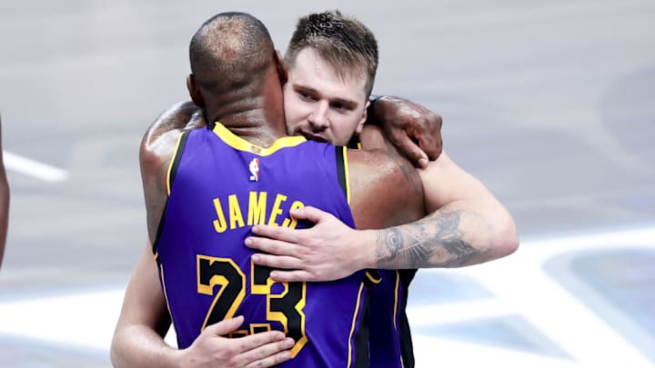 Apr 9, 2025; Dallas, Texas, USA;  Los Angeles Lakers guard Luka Doncic (77) celebrates with Los Angeles Lakers forward LeBron James (23) during the fourth quarter against the Dallas Mavericks at American Airlines Center. Mandatory Credit: Kevin Jairaj-Imagn Images