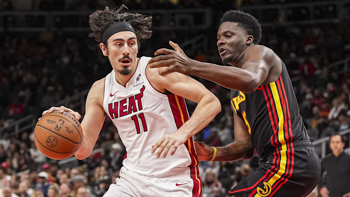 Dec 28, 2024; Atlanta, Georgia, USA; Miami Heat guard Jaime Jaquez Jr. (11) dribbles defended by Atlanta Hawks center Clint Capela (15) during the first half at State Farm Arena. Mandatory Credit: Dale Zanine-Imagn Images Dec 28, 2024; Atlanta, Georgia, USA; Miami Heat guard Jaime Jaquez Jr. (11) dribbles defended by Atlanta Hawks center Clint Capela (15) during the first half at State Farm Arena. Mandatory Credit: Dale Zanine-Imagn Images