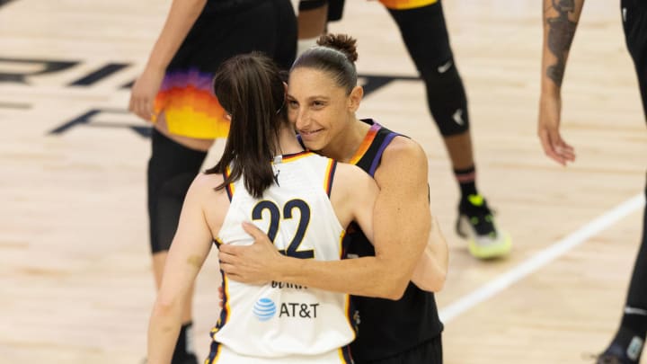Phoenix Mercury guard Diana Taurasi (3) embraces Indiana Fever guard Caitlin Clark (22) before tipoff on June 30, 2024, at Footprint Center in Phoenix.