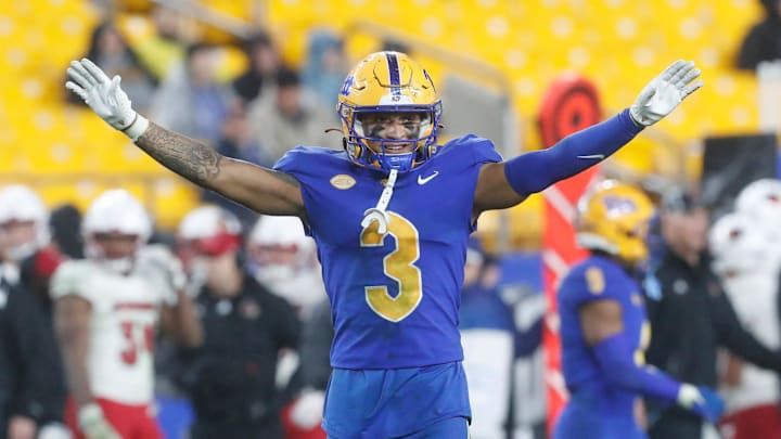 Oct 14, 2023; Pittsburgh, Pennsylvania, USA;  Pittsburgh Panthers defensive back Donovan McMillon (3) reacts after a defensive stop against the Louisville Cardinals during the fourth quarter at Acrisure Stadium. Mandatory Credit: Charles LeClaire-Imagn Images