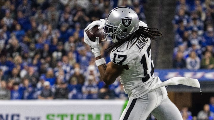 Dec 31, 2023; Indianapolis, Indiana, USA; Las Vegas Raiders wide receiver Davante Adams (17) catches a ball in the second half against the Indianapolis Colts at Lucas Oil Stadium. Mandatory Credit: Trevor Ruszkowski-Imagn Images