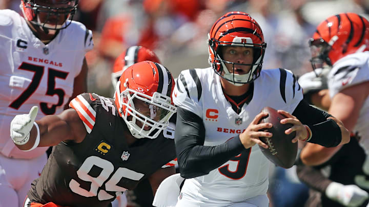 Cleveland Browns defensive end Myles Garrett (95) chases down Cincinnati Bengals quarterback Joe Burrow (9) during the first half of an NFL football game at Huntington Bank Field, Sept. 7, 2025, in Cleveland, Ohio.