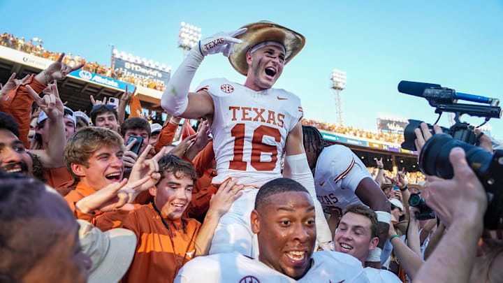 Texas Longhorns defensive back Michael Taaffe (16) celebrates with fans after beating Oklahoma Sooners 34-3 in the Red River Rivalry Football at the Cotton Bowl Stadium in Dallas, TX on Saturday Oct. 12, 2024.