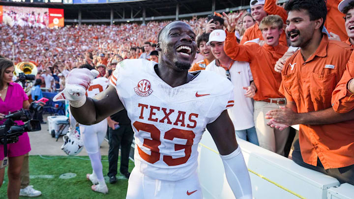 Texas Longhorns linebacker David Gbenda (33) celebrates a win over Oklahoma Sooners 34-3 in the Red River Rivalry Football Game between the University of Oklahoma Sooners and the University of Texas Longhorns at the Cotton Bowl Stadium in Dallas, TX on Saturday Oct. 12, 2024. Texas Longhorns linebacker David Gbenda (33) celebrates a win over Oklahoma Sooners 34-3 in the Red River Rivalry Football Game between the University of Oklahoma Sooners and the University of Texas Longhorns at the Cotton Bowl Stadium in Dallas, TX on Saturday Oct. 12, 2024.