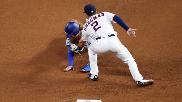 Oct 29, 2017; Houston, TX, USA; Los Angeles Dodgers designated hitter Justin Turner (10) is tagged out by Houston Astros third baseman Alex Bregman (2) in the 7th inning in game five of the 2017 World Series at Minute Maid Park.