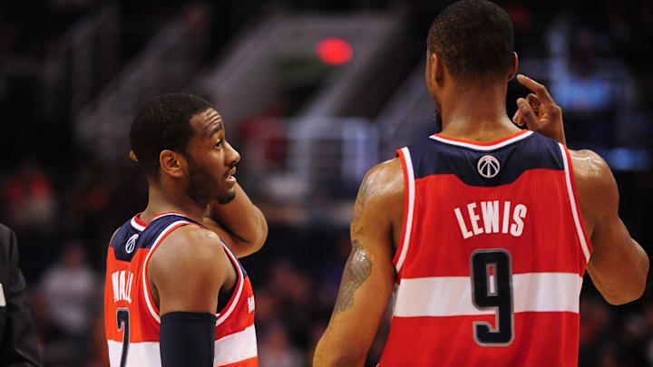 Feb. 20, 2012; Phoenix, AZ, USA; Washington Wizards teammates Rashard Lewis (right) and John Wall during game against the Phoenix Suns at the US Airways Center. The Suns defeated the Wizards 104-88. Mandatory Credit: Mark J. Rebilas-Imagn Images