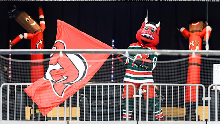 The New Jersey Devils mascot waves a flag at Prudential Center. Mandatory Credit: Vincent Carchietta-Imagn Images