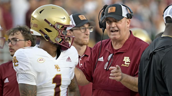 Sep 2, 2024; Tallahassee, Florida, USA; Boston College Eagles quarterback Thomas Castellanos (1) speaks with head coach Bill O'Brien before the game against the Florida State Seminoles at Doak S. Campbell Stadium. Mandatory Credit: Melina Myers-Imagn Images