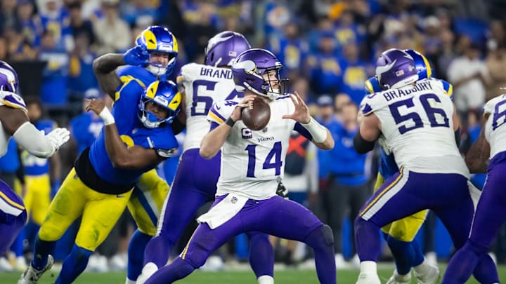 Jan 13, 2025; Glendale, AZ, USA; Minnesota Vikings quarterback Sam Darnold (14) against the Los Angeles Rams during an NFC wild card game at State Farm Stadium. Mandatory Credit: Mark J. Rebilas-Imagn Images Jan 13, 2025; Glendale, AZ, USA; Minnesota Vikings quarterback Sam Darnold (14) against the Los Angeles Rams during an NFC wild card game at State Farm Stadium. Mandatory Credit: Mark J. Rebilas-Imagn Images