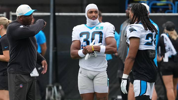 Backs coach Bernie Parmalee talks with running back Chuba Hubbard (30), running back Jonathon Brooks (25) during training camp at Bank of America Stadium. Mandatory Credit: Jim Dedmon-Imagn Images Backs coach Bernie Parmalee talks with running back Chuba Hubbard (30), running back Jonathon Brooks (25) during training camp at Bank of America Stadium. Mandatory Credit: Jim Dedmon-Imagn Images