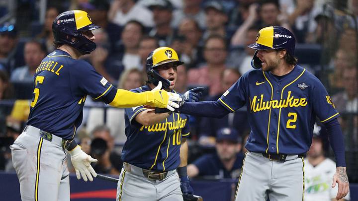 Oct 26, 2026; St. Petersburg, Florida, USA; Milwaukee Brewers outfielder Garrett Mitchell (5) celebrates with outfielder Sal Frelick (10) and second baseman Brice Turang (2) during the fifth inning against the Tampa Bay Rays in game three of the 2026 World Series at Tropicana Field. Mandatory Credit: Nathan Ray Seebeck-Imagn Images Oct 26, 2026; St. Petersburg, Florida, USA; Milwaukee Brewers outfielder Garrett Mitchell (5) celebrates with outfielder Sal Frelick (10) and second baseman Brice Turang (2) during the fifth inning against the Tampa Bay Rays in game three of the 2026 World Series at Tropicana Field. Mandatory Credit: Nathan Ray Seebeck-Imagn Images