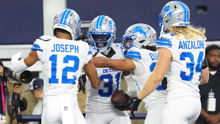 Detroit Lions safety Kerby Joseph celebrates with teammates after an interception against the Dallas Cowboys. Detroit Lions safety Kerby Joseph celebrates with teammates after an interception against the Dallas Cowboys.