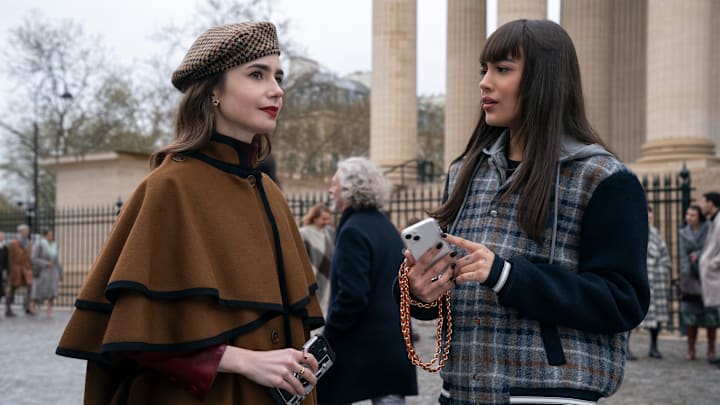 Emily in Paris. (L to R) Lily Collins as Emily, Thalia Besson as Genevieve in episode 407 of Emily in Paris