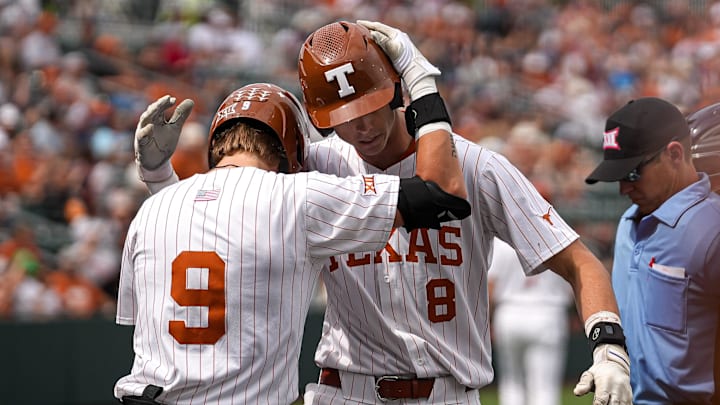 Texas Longhorns outfielder Jared Thomas (9) celebrates a home run by outfielder Will Gasparino (8) during the game against Washington at UFCU Disch   Falk Field on Saturday, March. 16, 2024 in Austin.