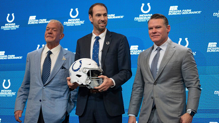 Shane Steichen, center, poses for photos with Colts Owner and CEO Jim Irsay, left, and General