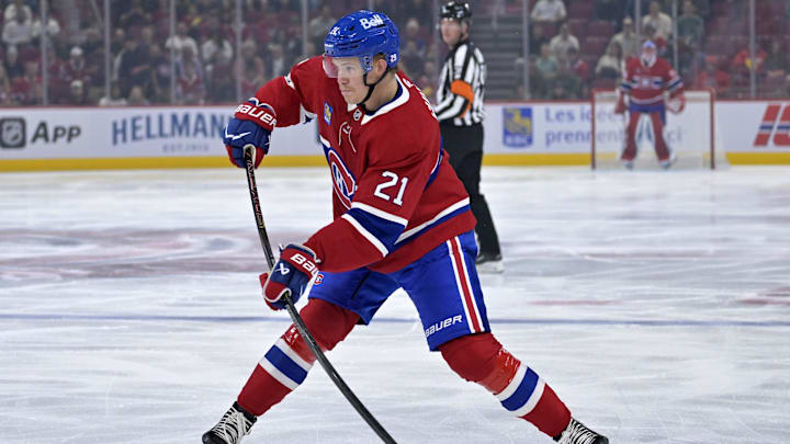 Sep 23, 2025; Montreal, Quebec, CAN; Montreal Canadiens defenseman Kaiden Guhle (21) plays the puck during the first period against the Philadelphia Flyers at the Bell Centre. Mandatory Credit: Eric Bolte-Imagn Images