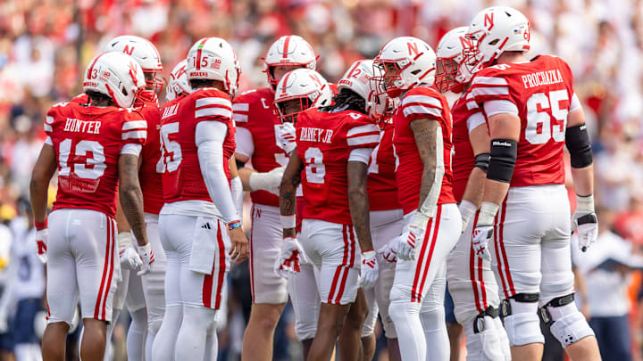 The Nebraska offense huddles against Michigan. The Nebraska offense huddles against Michigan.
