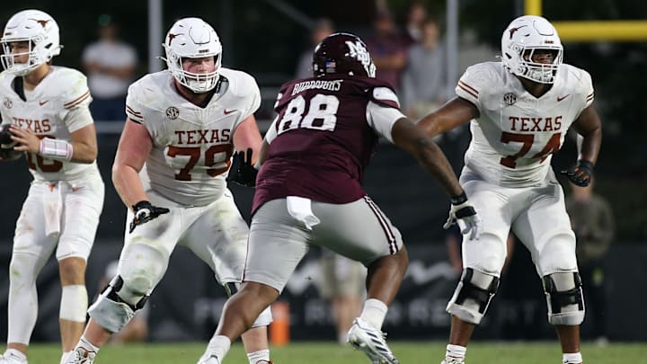 Oct 25, 2025; Starkville, Mississippi, USA; Texas Longhorns offensive linemen Connor Stroh (79) and Trevor Goosby (74) block Mississippi State Bulldogs defensive linemen Jamil Burroughs (88) during the fourth quarter at Davis Wade Stadium at Scott Field. Mandatory Credit: Petre Thomas-Imagn Images