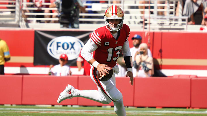 Oct 6, 2024; Santa Clara, California, USA; San Francisco 49ers quarterback Brock Purdy (13) controls the ball against the Arizona Cardinals during the first quarter at Levi's Stadium. Mandatory Credit: Kelley L Cox-Imagn Images