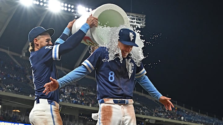 Apr 25, 2025; Kansas City, Missouri, USA; Kansas City Royals shortstop Bobby Witt Jr. (left) douses Kansas City Royals left fielder Drew Waters (8) with ice water after beating the Houston Astros at Kauffman Stadium. Mandatory Credit: Peter Aiken-Imagn Images Apr 25, 2025; Kansas City, Missouri, USA; Kansas City Royals shortstop Bobby Witt Jr. (left) douses Kansas City Royals left fielder Drew Waters (8) with ice water after beating the Houston Astros at Kauffman Stadium. Mandatory Credit: Peter Aiken-Imagn Images