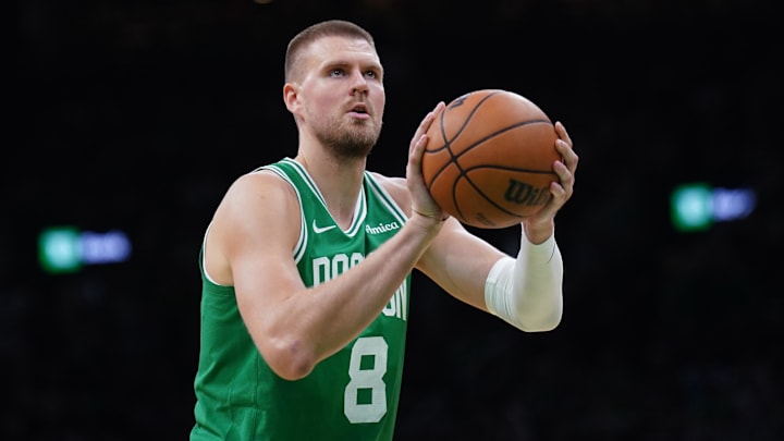 May 7, 2025; Boston, Massachusetts, USA; Boston Celtics center Kristaps Porzingis (8) shoots a free throw against the New York Knicks in the second half during game two of the second round for the 2025 NBA Playoffs at TD Garden. Mandatory Credit: David Butler II-Imagn Images