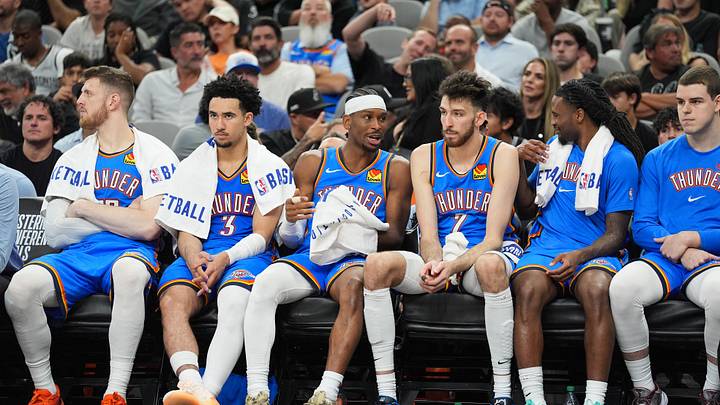 May 24, 2026; San Antonio, Texas, USA; Oklahoma City Thunder guard Shai Gilgeous-Alexander (2) exchanges words with center Chet Holmgren (7) on the bench in the fourth quarter against the San Antonio Spurs  during game four of the western conference finals for the 2026 NBA playoffs at Frost Bank Center. Mandatory Credit: Daniel Dunn-Imagn Images