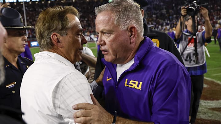 Nov 4, 2023; Tuscaloosa, Alabama, USA; Alabama Crimson Tide head coach Nick Saban talks with LSU Tigers head coach Brian Kelly after the second half at Bryant-Denny Stadium. Mandatory Credit: Butch Dill-Imagn Images