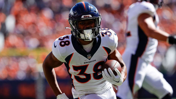 Sep 17, 2023; Denver, Colorado, USA; Denver Broncos running back Jaleel McLaughlin (38) runs for a touchdown in the first quarter against the Washington Commanders at Empower Field at Mile High. 