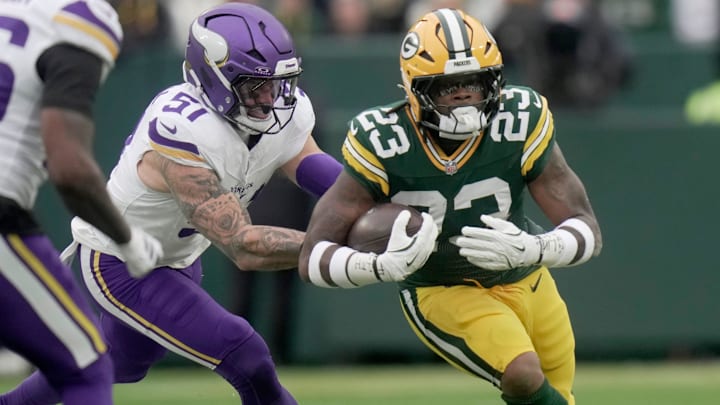 Green Bay Packers running back Emanuel Wilson (23) runs the ball during the first quarter of their game against the Minnesota Vikings Sunday, November 23, 2025 at Lambeau Field in Green Bay, Wisconsin.