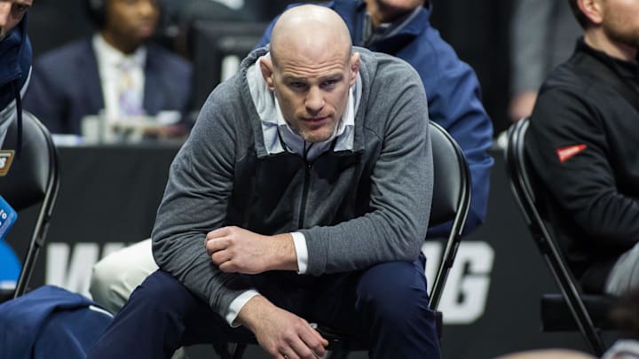 Penn State wrestling Cael Sanderson watches a Nittany Lions match during the NCAA Wrestling Championships.