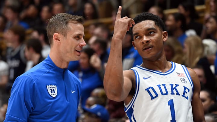 Feb 28, 2026; Durham, North Carolina, USA; Duke Blue Devils guard Caleb Foster (1) gestures to head coach Jon Scheyer during the second half against the Virginia Cavaliers at Cameron Indoor Stadium.   Duke won 77-51. 