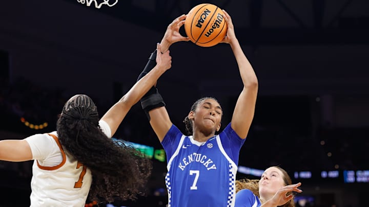 Mar 28, 2026; Fort Worth, TX, USA; Kentucky Wildcats forward Teonni Key (7) grabs a rebound against Texas Longhorns guard Jordan Lee (7) during the first half at Dickies Arena. Mandatory Credit: Chris Jones-Imagn Images Mar 28, 2026; Fort Worth, TX, USA; Kentucky Wildcats forward Teonni Key (7) grabs a rebound against Texas Longhorns guard Jordan Lee (7) during the first half at Dickies Arena. Mandatory Credit: Chris Jones-Imagn Images