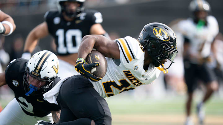Missouri's running back Ahmad Hardy (29) runs against Vanderbilt's safety Randon Fontenette (2) during their game at FirstBank Stadium in Nashville, Tenn., Saturday, Oct. 25, 2025. Missouri's running back Ahmad Hardy (29) runs against Vanderbilt's safety Randon Fontenette (2) during their game at FirstBank Stadium in Nashville, Tenn., Saturday, Oct. 25, 2025.