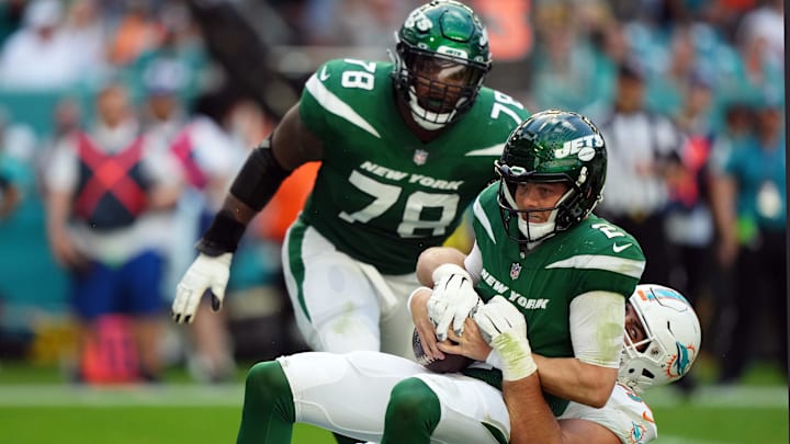 Dec 17, 2023; Miami Gardens, Florida, USA; Miami Dolphins defensive tackle Zach Sieler (92) sacks New York Jets quarterback Zach Wilson (2) during the first half at Hard Rock Stadium. Mandatory Credit: Jasen Vinlove-Imagn Images