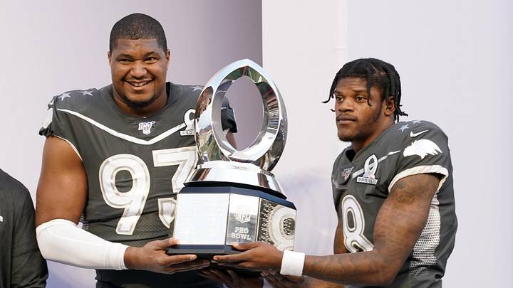 Jan 26, 2020; Orlando, Florida, USA; AFC defensive end Calais Campbell of the Jacksonville Jaguars and quarterback Lamar Jackson of the Baltimore Ravens (8) pose with trophy after the 2020 NFL Pro Bowl at Camping World Stadium. The AFC defeated the NFC 38-33.  Mandatory Credit: Kirby Lee-Imagn Images