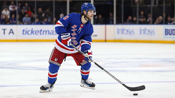 Nov 25, 2024; New York, New York, USA; New York Rangers defenseman Zac Jones (6) looks to pass against the St. Louis Blues during the second period at Madison Square Garden. Mandatory Credit: Danny Wild-Imagn Images