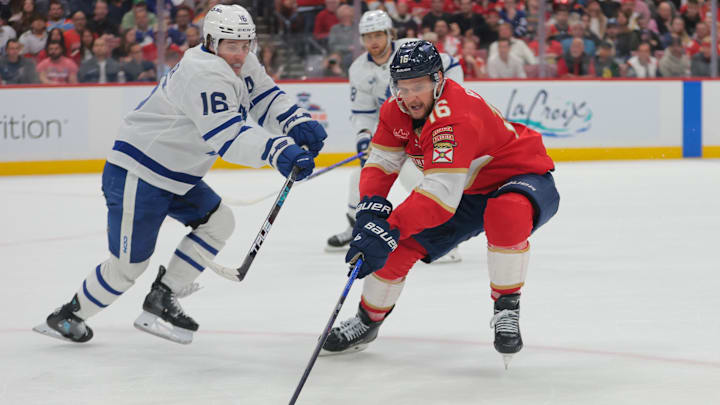 May 16, 2025; Sunrise, Florida, USA; Florida Panthers center Aleksander Barkov (16) moves the puck against Toronto Maple Leafs right wing Mitch Marner (16) during the second period in game six of the second round of the 2025 Stanley Cup Playoffs at Amerant Bank Arena. Mandatory Credit: Sam Navarro-Imagn Images