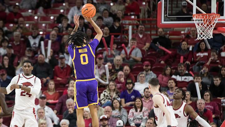 Feb 12, 2025; Fayetteville, Arkansas, USA; LSU Tigers guard Vyctorius Miller (0) shoots the ball during the second half against the Arkansas Razorbacks at Bud Walton Arena. Arkansas won 70-58. Mandatory Credit: Brett Rojo-Imagn Images Feb 12, 2025; Fayetteville, Arkansas, USA; LSU Tigers guard Vyctorius Miller (0) shoots the ball during the second half against the Arkansas Razorbacks at Bud Walton Arena. Arkansas won 70-58. Mandatory Credit: Brett Rojo-Imagn Images