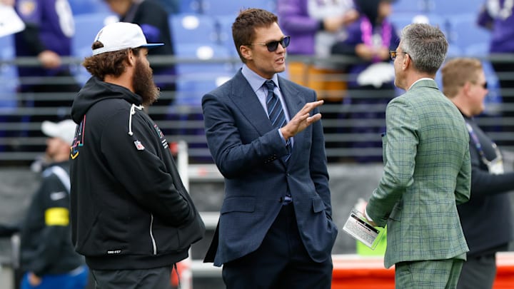 Oct 12, 2025; Baltimore, Maryland, USA; Fox Sports announcer Tom Brady looks on before the game between the Baltimore Ravens and the Los Angeles Rams at M&T Bank Stadium. Mandatory Credit: Peter Casey-Imagn Images