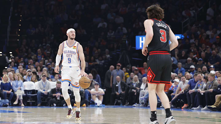 Mar 31, 2025; Oklahoma City, Oklahoma, USA; Oklahoma City Thunder guard Alex Caruso (9) dribbles down the court against Chicago Bulls guard Josh Giddey (3) during the second quarter at Paycom Center. Mandatory Credit: Alonzo Adams-Imagn Images Mar 31, 2025; Oklahoma City, Oklahoma, USA; Oklahoma City Thunder guard Alex Caruso (9) dribbles down the court against Chicago Bulls guard Josh Giddey (3) during the second quarter at Paycom Center. Mandatory Credit: Alonzo Adams-Imagn Images