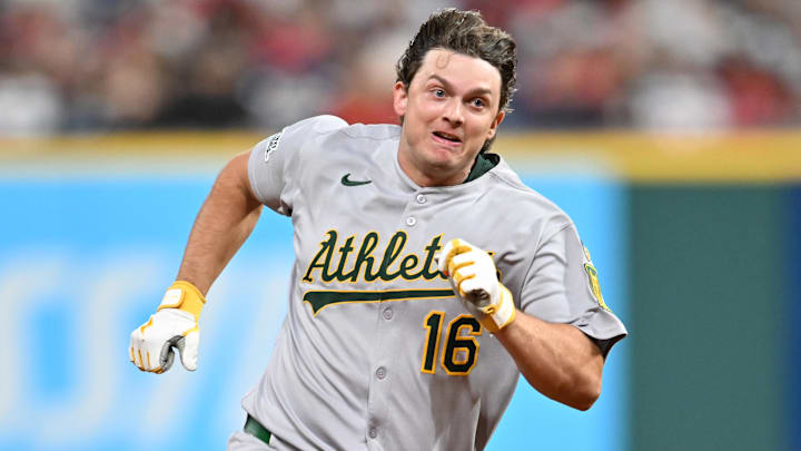 Jul 18, 2025; Cleveland, Ohio, USA; Athletics first baseman Nick Kurtz (16) rounds third base en route to a triple during the ninth inning against the Cleveland Guardians at Progressive Field. Mandatory Credit: Ken Blaze-Imagn Images