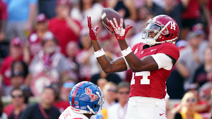 Sep 23, 2023; Tuscaloosa, Alabama, USA; Alabama Crimson Tide wide receiver Jalen Hale (14) hauls in a 33-yard touchdown over Mississippi Rebels safety Isheem Young (1) during the third quarter at Bryant-Denny Stadium. Mandatory Credit: John David Mercer-Imagn Images Sep 23, 2023; Tuscaloosa, Alabama, USA; Alabama Crimson Tide wide receiver Jalen Hale (14) hauls in a 33-yard touchdown over Mississippi Rebels safety Isheem Young (1) during the third quarter at Bryant-Denny Stadium. Mandatory Credit: John David Mercer-Imagn Images