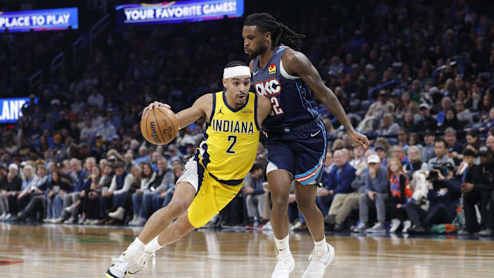 Jan 23, 2026; Oklahoma City, Oklahoma, USA; Indiana Pacers guard/forward Andrew Nembhard (2) drives to the basket past Oklahoma City Thunder guard Cason Wallace (22) during the second half at Paycom Center. Mandatory Credit: Alonzo Adams-Imagn Images