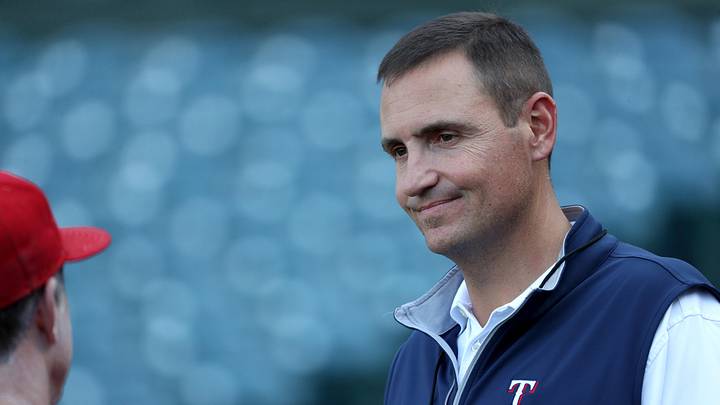 Texas Rangers president of baseball operations Chris Young talks with a coach. 