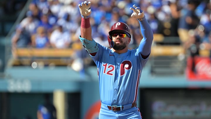 Oct 9, 2025; Los Angeles, California, USA; Philadelphia Phillies left fielder Kyle Schwarber (12) reacts after a double in the first inning against the Los Angeles Dodgers during game four of the NLDS round for the 2025 MLB playoffs at Dodger Stadium. Mandatory Credit: Jayne Kamin-Oncea-Imagn Images