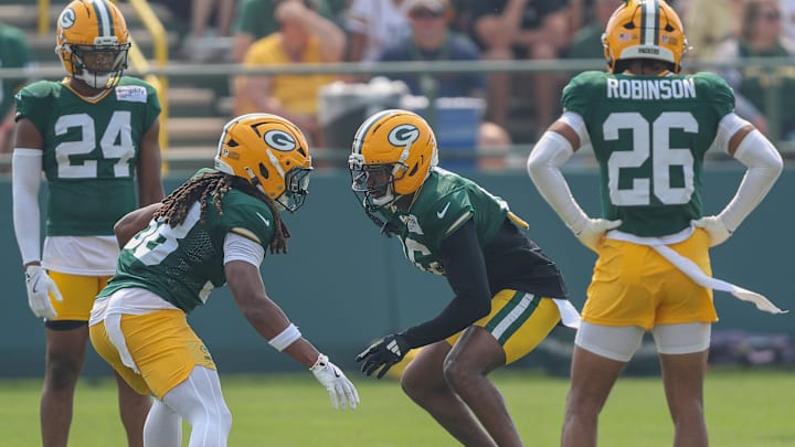 Green Bay cornerbacks Gregory Junior (28) and Bo Melton (16) run through a drill during practice on Thursday, July 31, 2025, at Ray Nitschke Field in Ashwaubenon, Wis. 
Tork Mason/USA TODAY NETWORK-Wisconsin